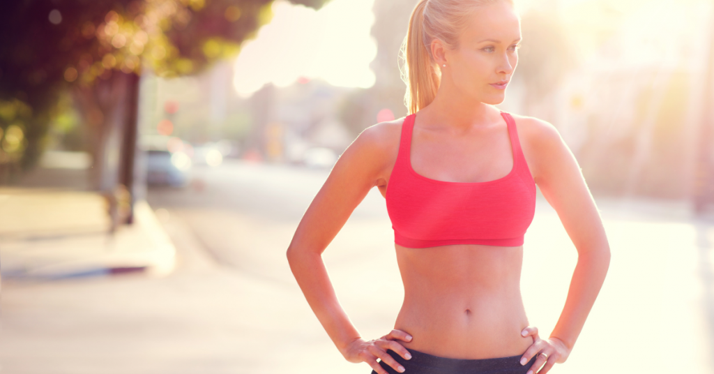 Woman contemplating tummy tuck procedure.