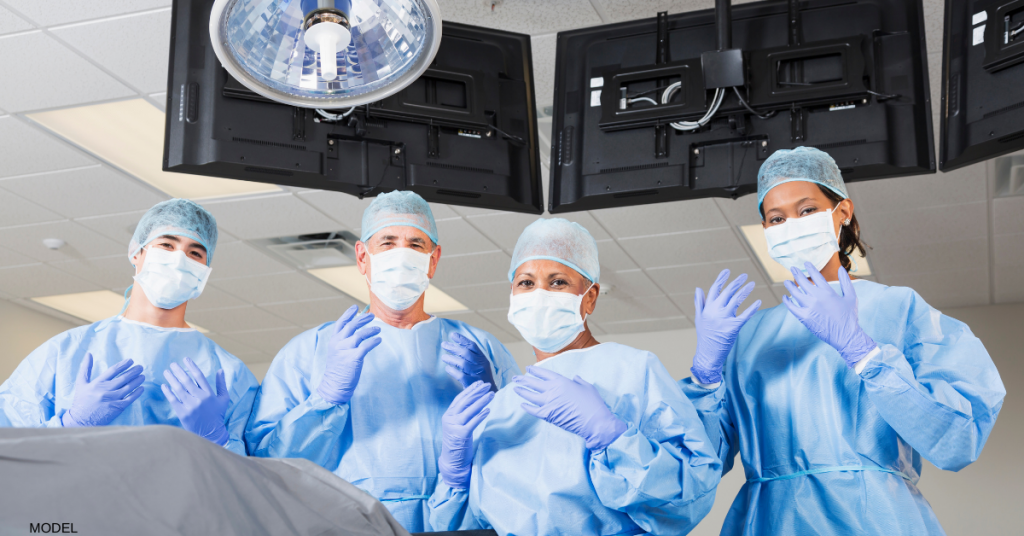 Doctors performing plastic surgery
