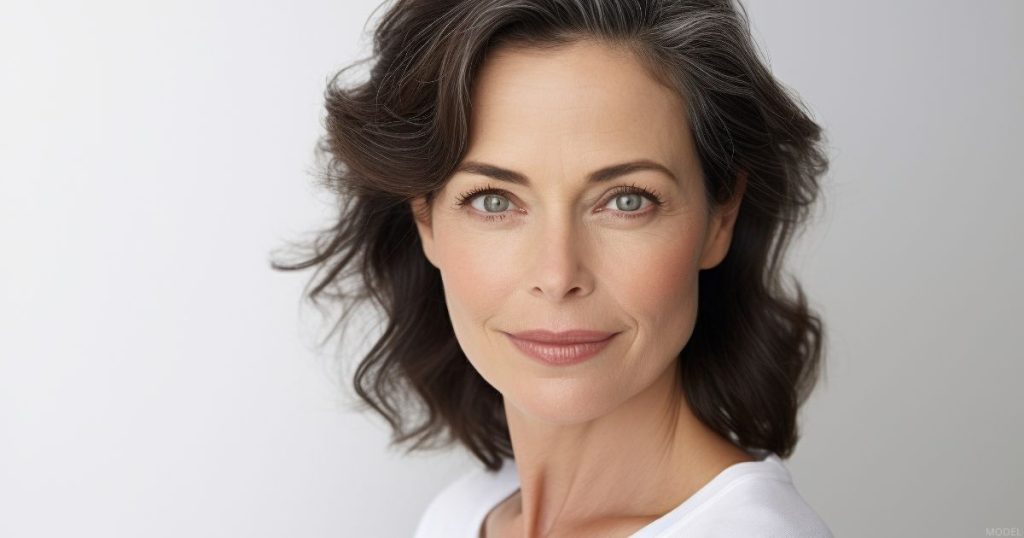 Woman's face, illustrating facelift surgical outcome (model).